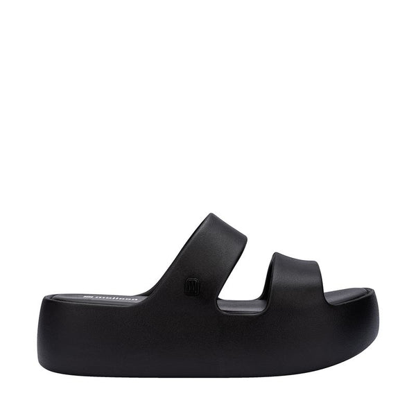 Slide Melissa Free Line Platform adulto na cor preta, com tira única larga e solado plataforma – calçado moderno, leve e confortável para o uso diário.

Palavra-chave principal:
Melissa Free Line Platform

Palavras-chave relacionadas:
Melissa 37824, slide preto Melissa, sandália plataforma Melissa, Melissa com tira larga, calçado confortável, slide moderno, Melissa casual, sandália preta adulto, Melissa plataforma, calçado leve adulto