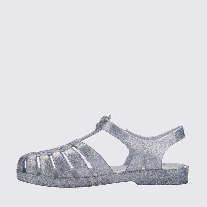 Sandália Melissa Possession Shiny adulto na cor vidro glitter, com tiras estilo fisherman, fechamento em fivela e acabamento brilhante – calçado retrô, leve e confortável.

Palavra-chave principal:
Melissa Possession Shiny

Palavras-chave relacionadas:
Melissa 33520, sandália vidro glitter, Melissa brilho, sandália fisherman Melissa, Melissa com fivela, calçado confortável adulto, Melissa retrô, sandália transparente brilhante, Melissa clássica, sandália leve adulto