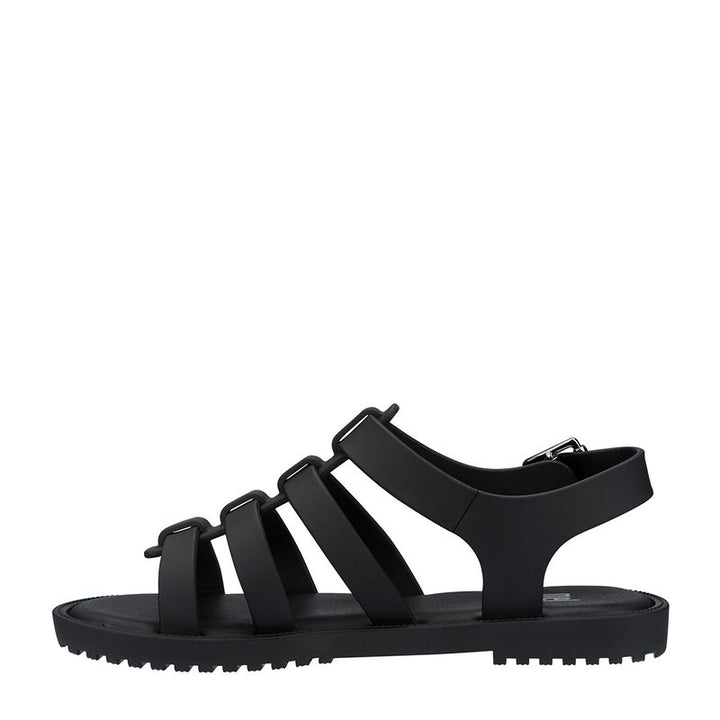 Sandália infantil Mini Melissa Flox na cor preto opaco, com tiras largas no cabedal, fechamento com fivela lateral e solado reto. Produzida em Melflex, é leve, resistente e ideal para o dia a dia das crianças, combinando conforto, segurança e estilo moderno.

Palavra-chave principal: Mini Melissa Flox Infantil
Palavras-chave relacionadas: sandália preta infantil, Melflex, tiras largas, fivela lateral, calçado confortável, sandália resistente, estilo casual infantil.