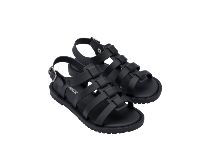 Sandália infantil Mini Melissa Flox na cor preto opaco, com tiras largas no cabedal, fechamento com fivela lateral e solado reto. Produzida em Melflex, é leve, resistente e ideal para o dia a dia das crianças, combinando conforto, segurança e estilo moderno.

Palavra-chave principal: Mini Melissa Flox Infantil
Palavras-chave relacionadas: sandália preta infantil, Melflex, tiras largas, fivela lateral, calçado confortável, sandália resistente, estilo casual infantil.