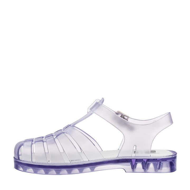Sandália infantil Mini Melissa Possession na cor vidro transparente, com tiras em estilo fisherman, fecho lateral com fivela e solado reto. Produzida em Melflex, é leve, flexível e perfeita para looks estilosos e divertidos no dia a dia das crianças.

Palavra-chave principal: Mini Melissa Possession Infantil
Palavras-chave relacionadas: sandália infantil transparente, Melflex, fecho com fivela, calçado confortável, estilo clássico, sandália jelly.