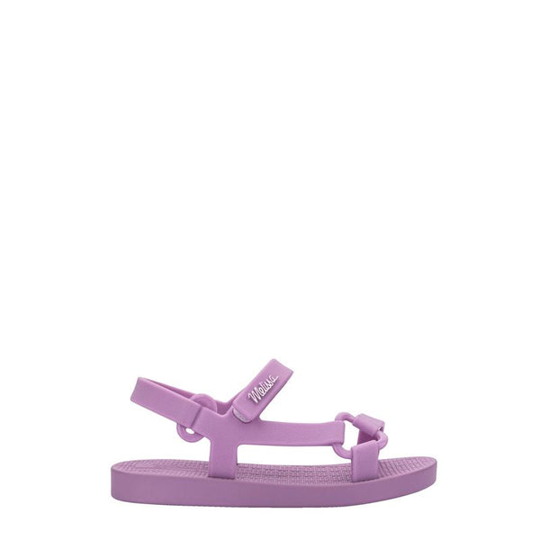 Sandália infantil Mini Melissa Sun Downtown Baby na cor lilás, modelo unissex com acabamento fosco. Produzida em Melflex, é leve, confortável e conta com fechamento em velcro, garantindo segurança e praticidade. Perfeita para dias quentes e para looks combinando
