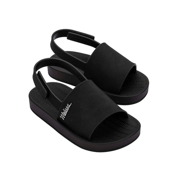 Sandália Mini Melissa Sun Sunset Baby na cor preta, com tira larga única, fechamento traseiro em velcro e solado reto – calçado leve, seguro e confortável para bebês.

Palavra-chave principal:
Mini Melissa Sun Sunset Baby

Palavras-chave relacionadas:
Melissa 35764, sandália preta bebê, slide infantil Melissa, sandália com velcro, calçado confortável baby, Melissa tira larga, sandália segura infantil, Mini Melissa preta, sandália prática bebê, Melissa primeiros passos