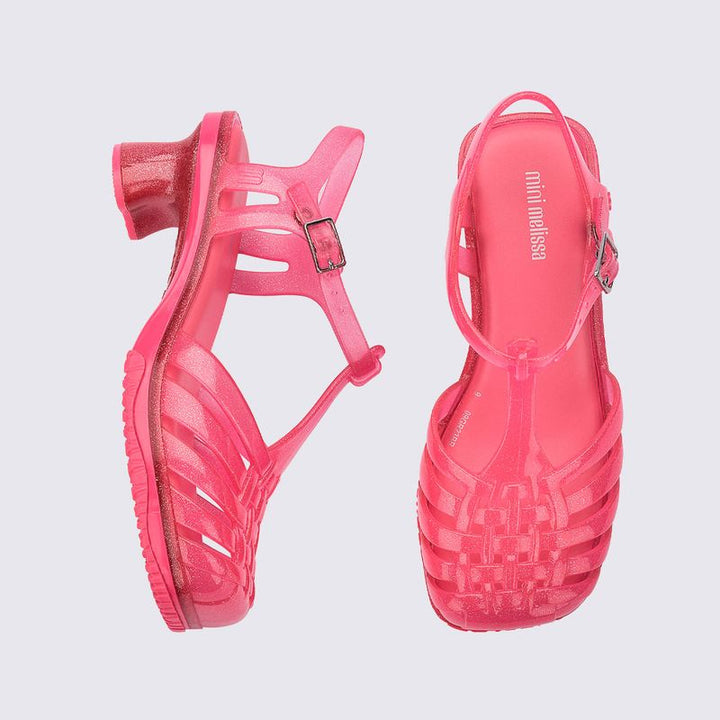 Sandália infantil Mini Melissa Vixen na cor rosa transparente, com tiras cruzadas e acabamento translúcido. Produzida em Melflex, é leve, confortável e estilosa, ideal para o dia a dia das crianças com muito charme e praticidade