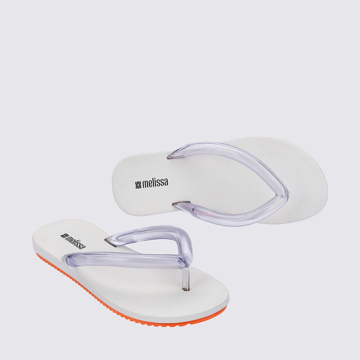 Melissa Flip Flop Airflow Adulto Branco e Laranja 37942 – chinelo leve e moderno com tiras vazadas, solado anatômico e design minimalista, ideal para conforto no dia a dia com estilo descomplicado.

🔑 Palavra-chave principal:
Melissa Flip Flop Airflow Adulto Branco e Laranja

🔍 Palavras-chave relacionadas:
Chinelo Melissa Airflow, Melissa branco laranja, chinelo leve Melissa, flip flop Melissa adulto
