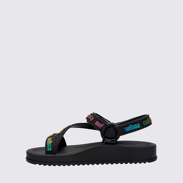 Sandália infantil Mini Melissa Stripes M.Lover na cor preta, com tiras cruzadas e fechamento em velcro no tornozelo. Confeccionada em Melflex, é leve, confortável e segura, ideal para o uso diário com estilo e praticidade.

Palavra-chave principal: Mini Melissa Stripes M.Lover Infantil
Palavras-chave relacionadas: sandália preta infantil, Melflex, tiras cruzadas, fechamento em velcro, calçado infantil confortável, estilo básico e versátil.