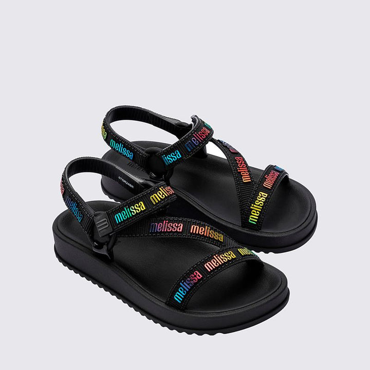 Sandália infantil Mini Melissa Stripes M.Lover na cor preta, com tiras cruzadas e fechamento em velcro no tornozelo. Confeccionada em Melflex, é leve, confortável e segura, ideal para o uso diário com estilo e praticidade.

Palavra-chave principal: Mini Melissa Stripes M.Lover Infantil
Palavras-chave relacionadas: sandália preta infantil, Melflex, tiras cruzadas, fechamento em velcro, calçado infantil confortável, estilo básico e versátil.